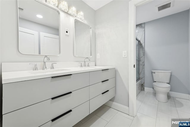 full bathroom with vanity, toilet, and  shower combination