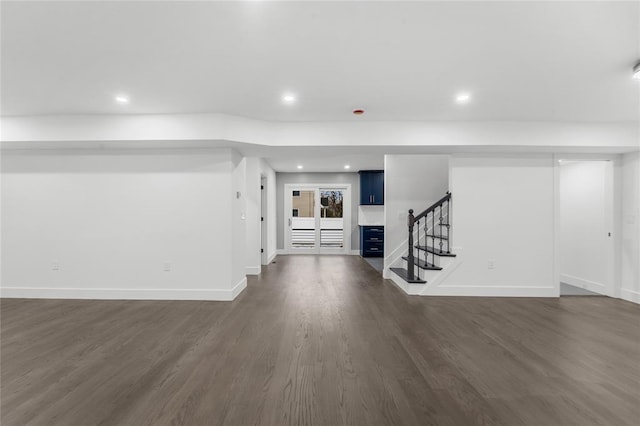 unfurnished living room with dark hardwood / wood-style floors