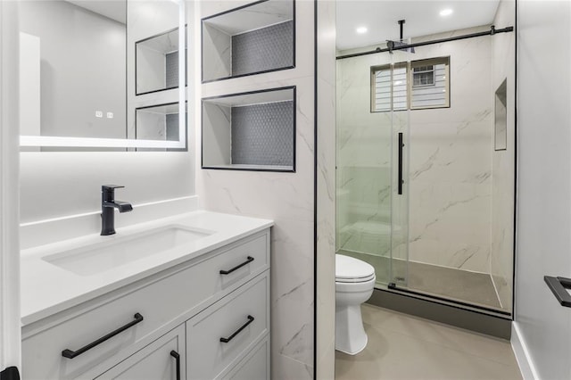 bathroom featuring toilet, recessed lighting, vanity, tile walls, and a marble finish shower