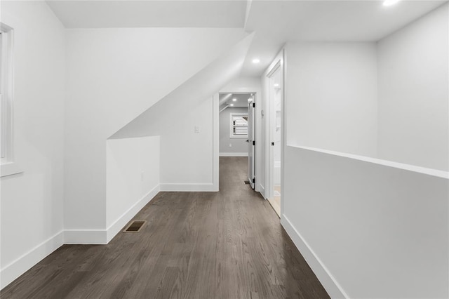 interior space featuring dark wood-type flooring, recessed lighting, visible vents, and baseboards