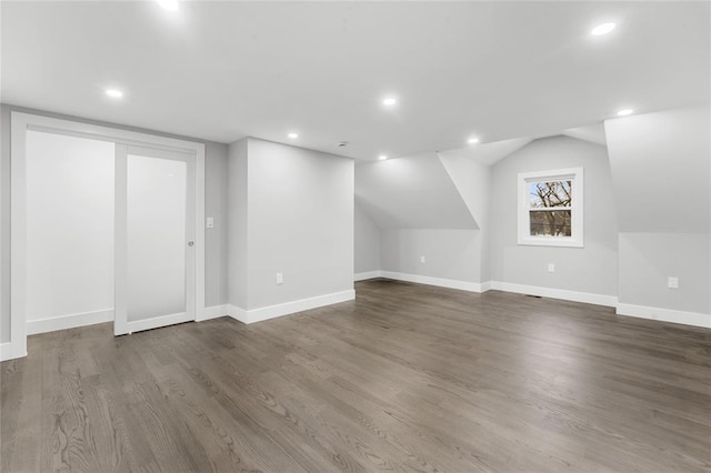 bonus room with recessed lighting, baseboards, and wood finished floors