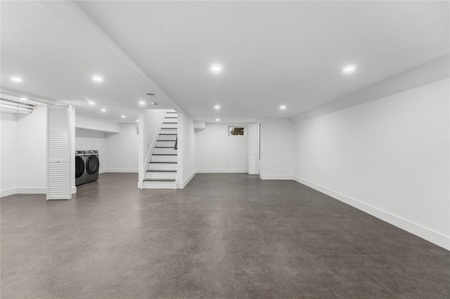 finished basement featuring recessed lighting, baseboards, stairway, and washing machine and clothes dryer