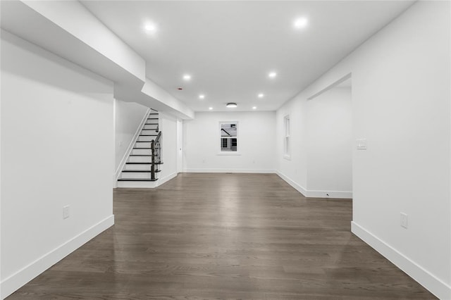 interior space with stairs, baseboards, dark wood finished floors, and recessed lighting