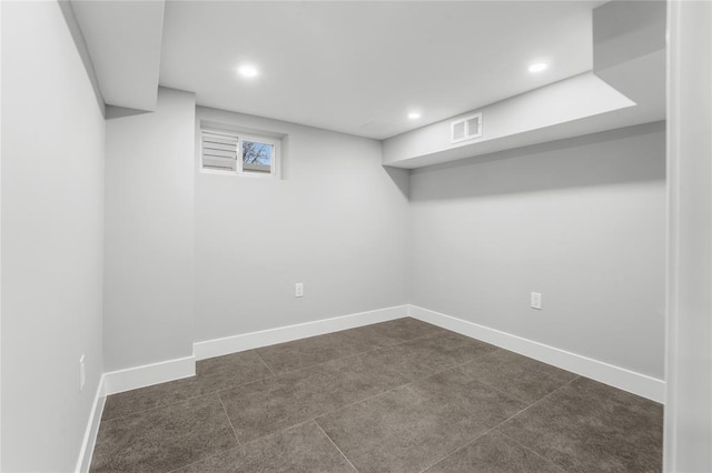 below grade area featuring recessed lighting, visible vents, and baseboards