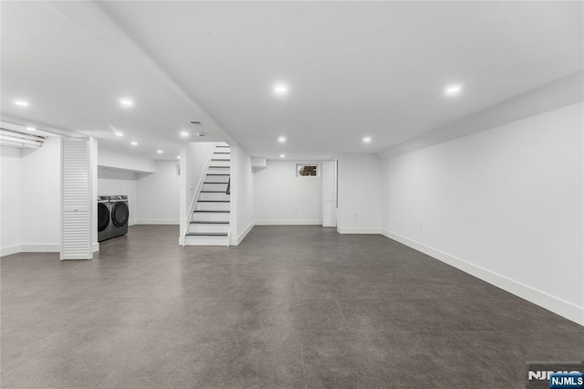 finished below grade area with baseboards, stairway, separate washer and dryer, and recessed lighting