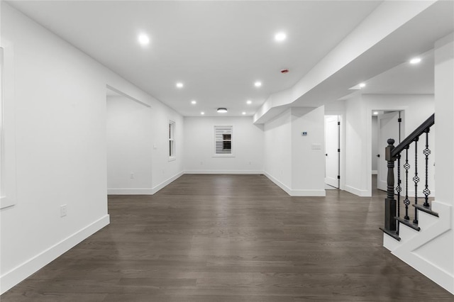 interior space with recessed lighting, dark wood finished floors, baseboards, and stairs