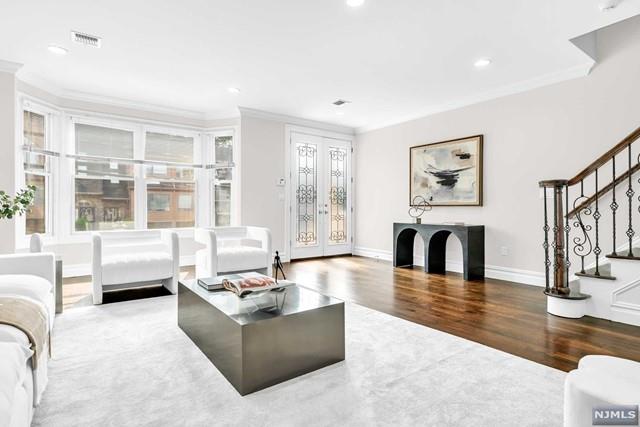 living room with hardwood / wood-style floors, french doors, and crown molding