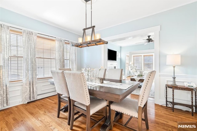 dining room featuring ceiling fan and light wood-type flooring