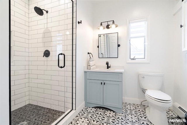 bathroom with an enclosed shower, vanity, a baseboard radiator, tile patterned flooring, and toilet