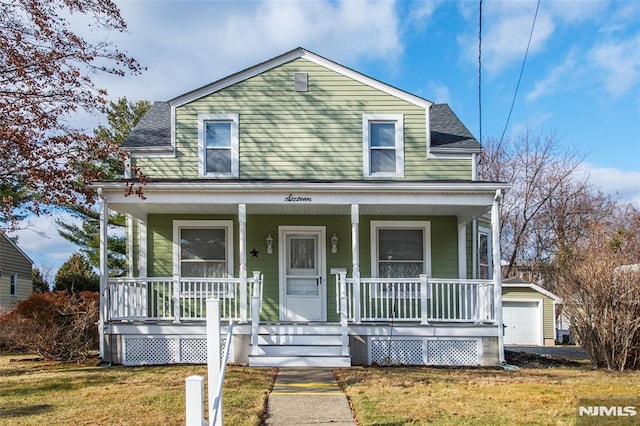 view of front of property with a front yard and covered porch