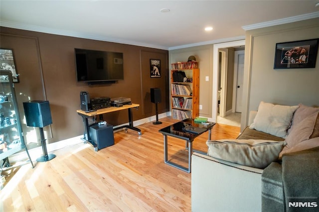 living room with hardwood / wood-style flooring and ornamental molding