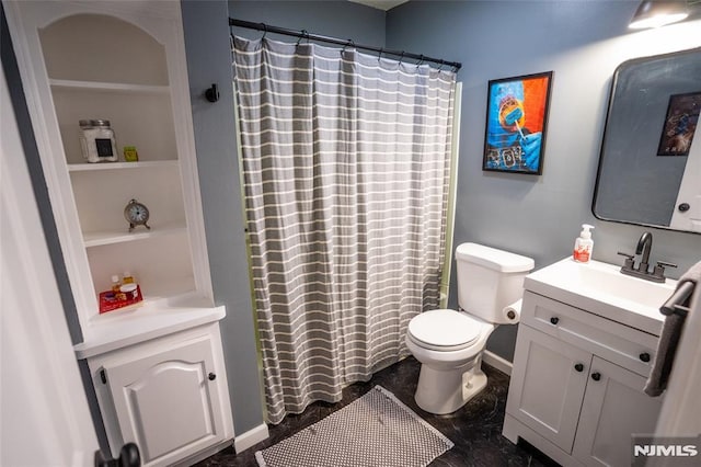 bathroom with vanity, toilet, and curtained shower