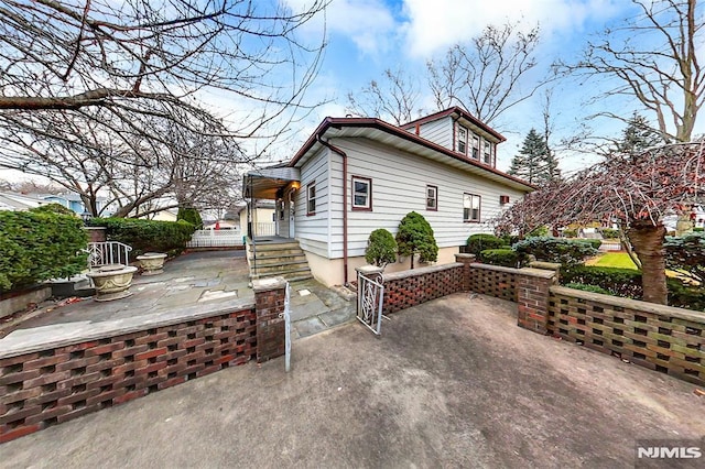 rear view of property featuring a patio