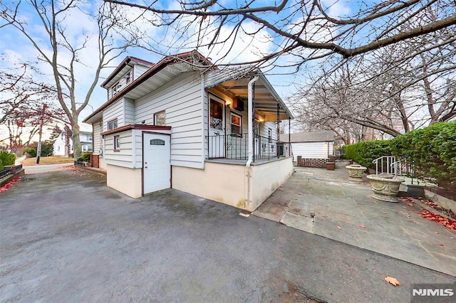 view of side of home with a patio