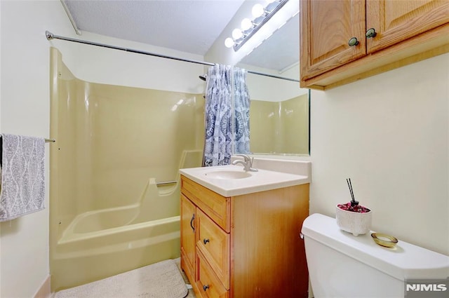 full bathroom featuring vanity, toilet, and shower / bathtub combination with curtain