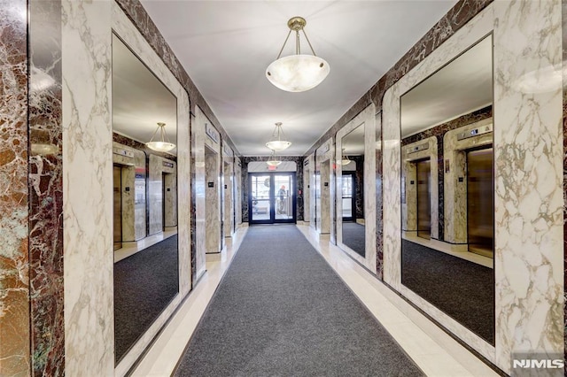 corridor featuring french doors