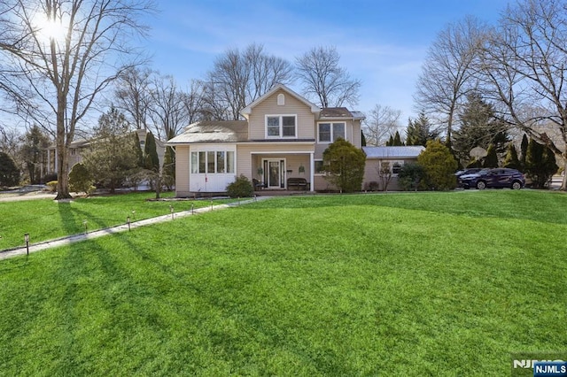 front of property with a front lawn and a porch