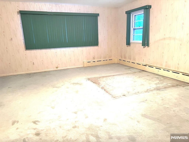 unfurnished room featuring a baseboard radiator