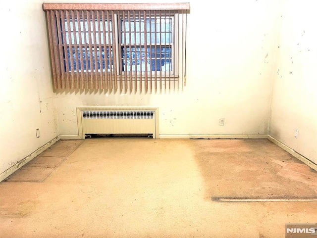 empty room featuring radiator heating unit