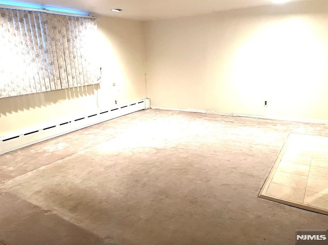 basement with a baseboard heating unit