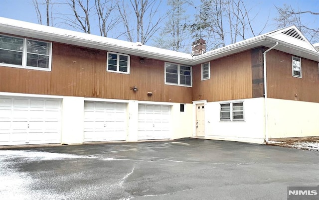 view of side of property featuring a garage