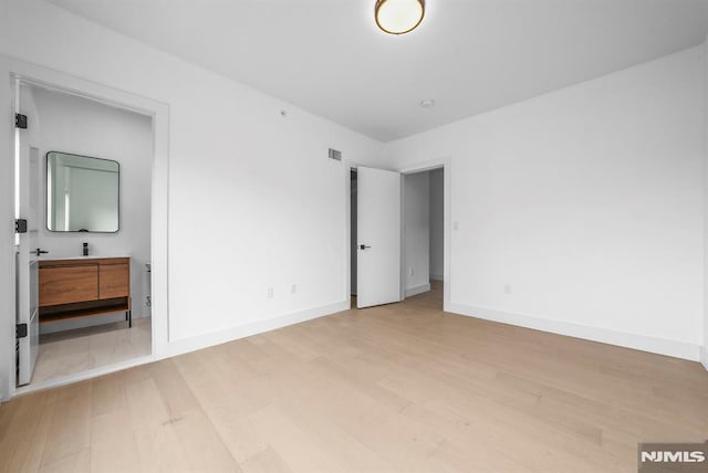 unfurnished bedroom with light hardwood / wood-style flooring