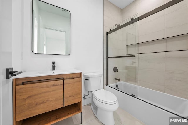 full bathroom with tile patterned flooring, vanity, toilet, and enclosed tub / shower combo