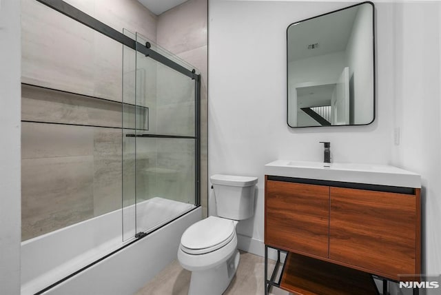 full bathroom featuring vanity, toilet, and enclosed tub / shower combo