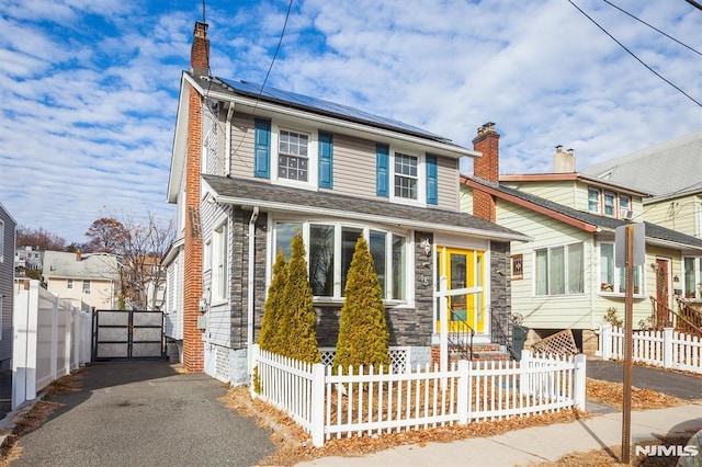 view of front of house featuring solar panels