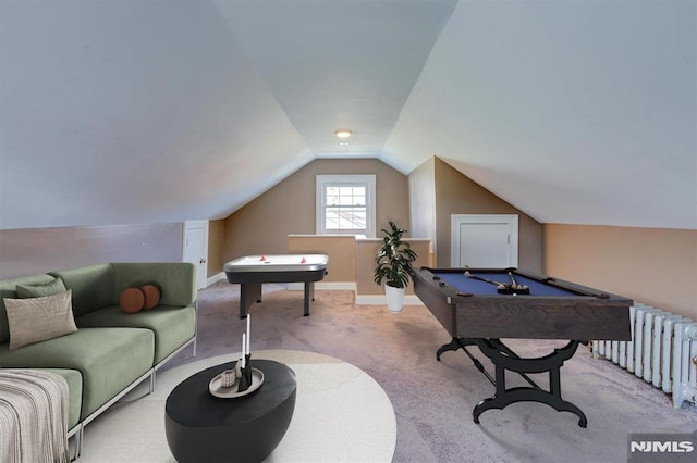 playroom featuring radiator heating unit, light colored carpet, vaulted ceiling, and pool table