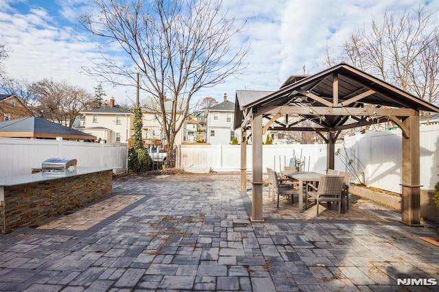 view of patio / terrace with a gazebo and exterior kitchen