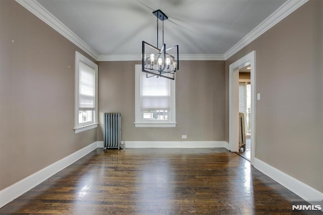 unfurnished dining area featuring dark hardwood / wood-style floors, radiator, ornamental molding, and a notable chandelier