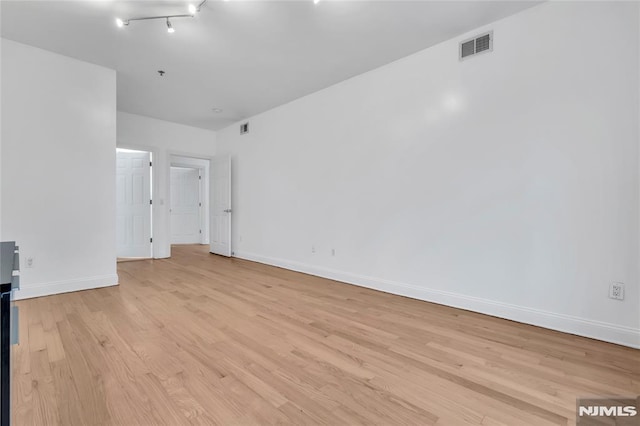 spare room with light wood-type flooring