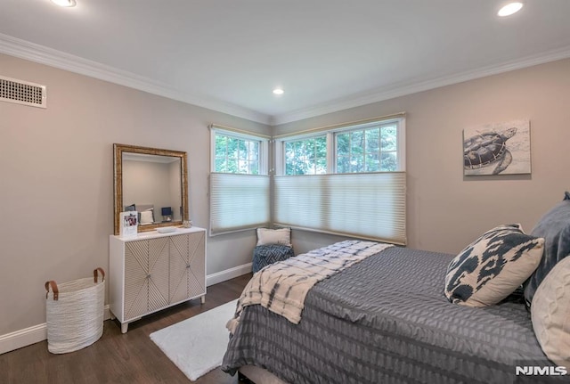 bedroom featuring dark hardwood / wood-style floors and ornamental molding