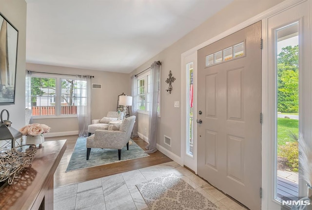 entryway with light tile patterned floors