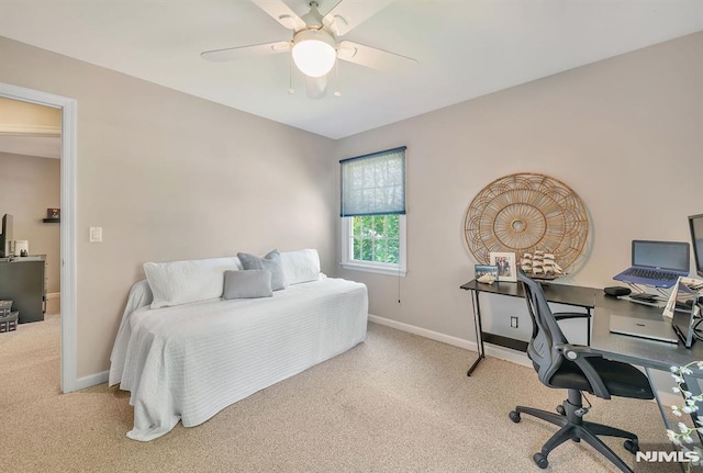 carpeted bedroom with ceiling fan