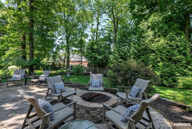 view of patio with an outdoor fire pit