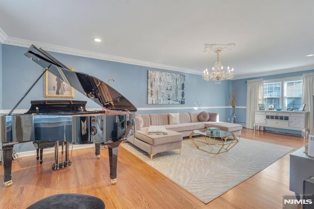 living room featuring a chandelier, light wood-type flooring, and ornamental molding