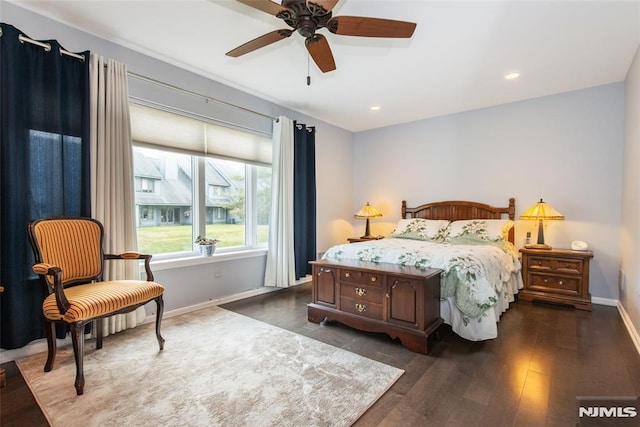 bedroom featuring ceiling fan and dark hardwood / wood-style flooring