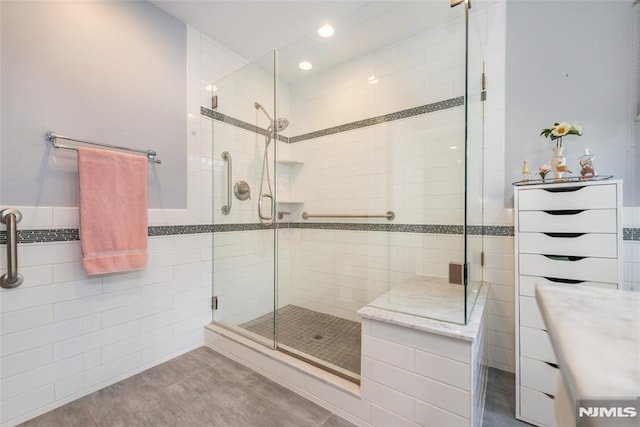 bathroom with a shower with shower door