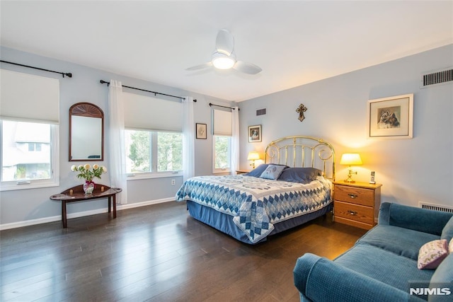 bedroom featuring dark hardwood / wood-style flooring and ceiling fan