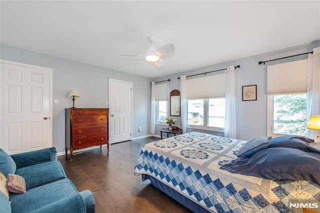 bedroom featuring ceiling fan and dark hardwood / wood-style flooring