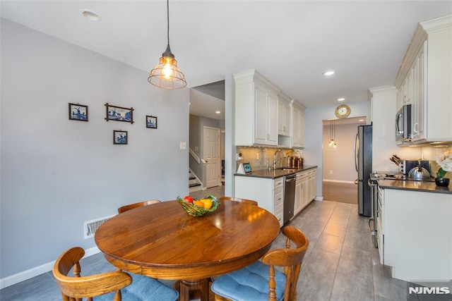 dining space with sink