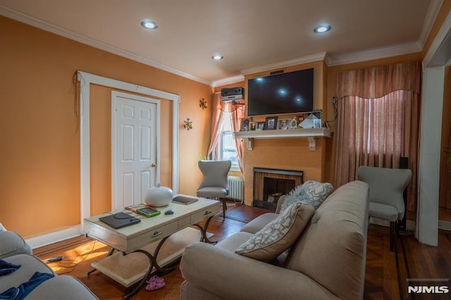 living room featuring a fireplace, crown molding, and hardwood / wood-style floors