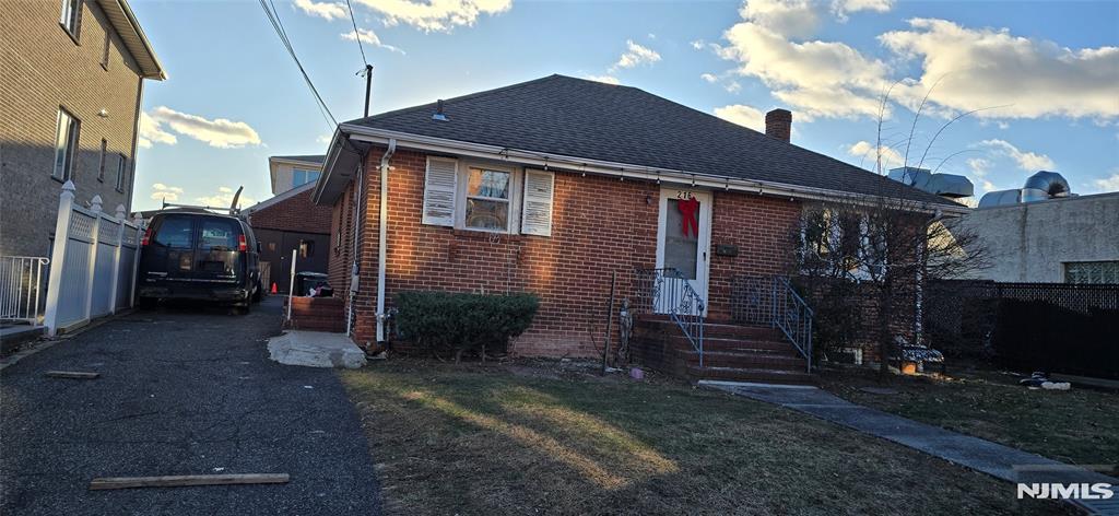 bungalow with a front lawn