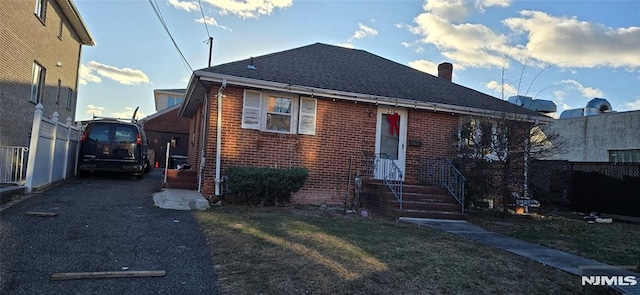 bungalow with a front lawn