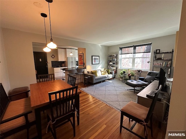 dining room featuring wood-type flooring