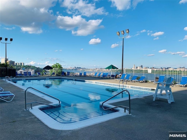 view of swimming pool featuring a patio area