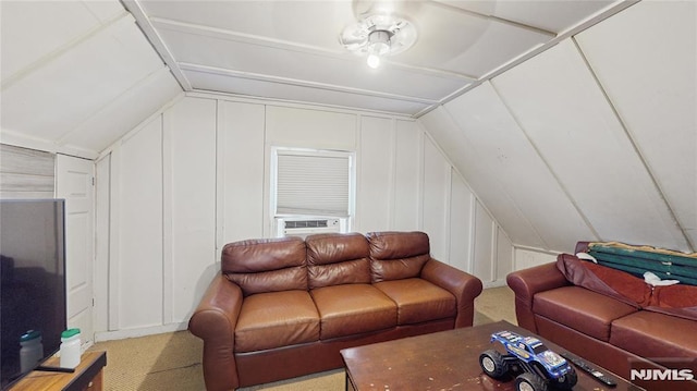 living room featuring cooling unit, lofted ceiling, and ceiling fan