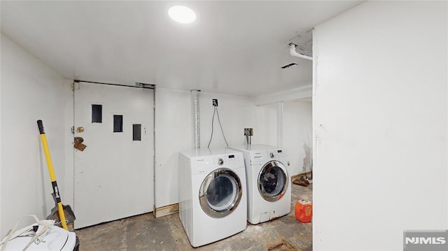 washroom featuring washer and dryer